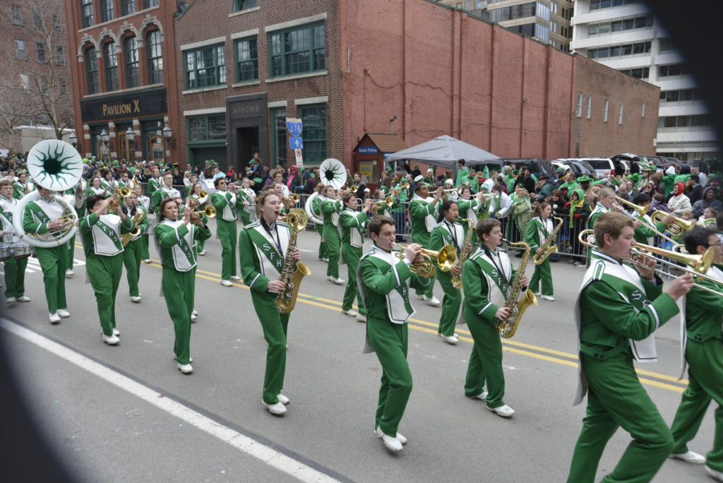 Photo of People Marching in the St. Patrick's Day Parade in Downtown Pittsburgh