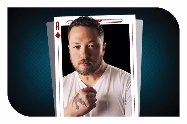 A graphic of a man who is placed inside of an Ace of Diamonds with a bird tattoo on his hand.