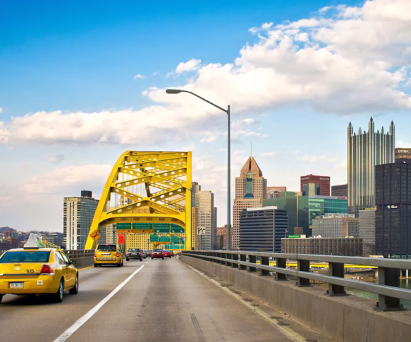 MeetPittsburgh-Approaching-Fort-Pitt-Bridge-with-city